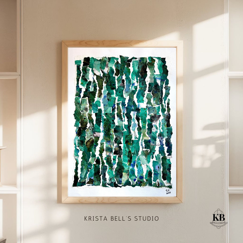 Framed abstract art print with green and blue patterns on a wall, featuring 'Krista Bell's Studio' branding.