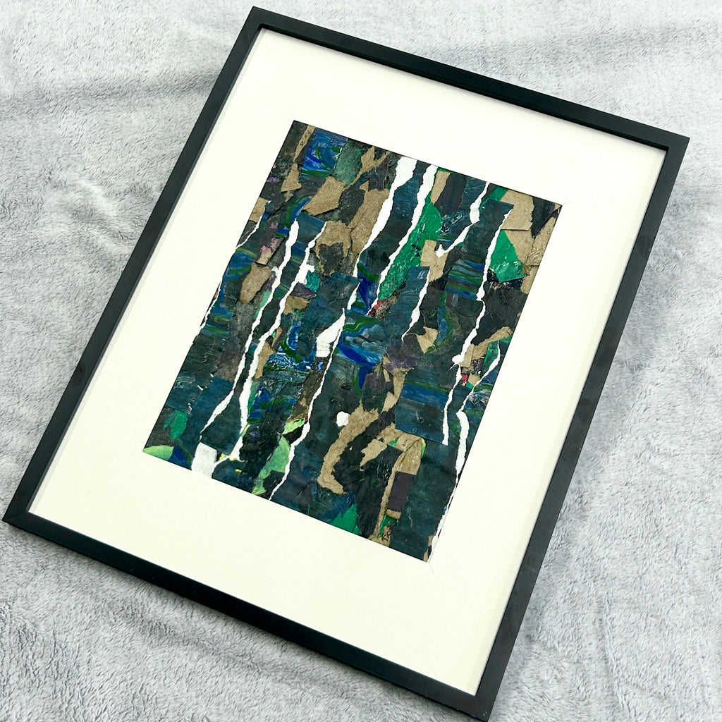 Framed abstract art piece on a textured surface. Representing growth and stability forged in tough times.