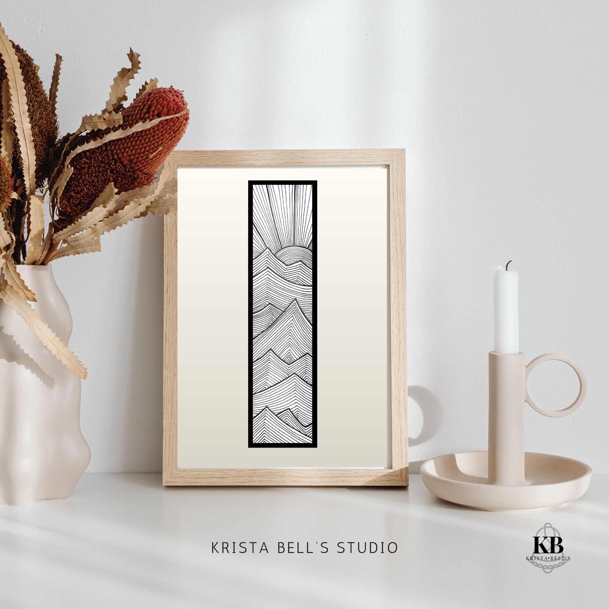 Framed abstract artwork on a white surface with decorative elements.