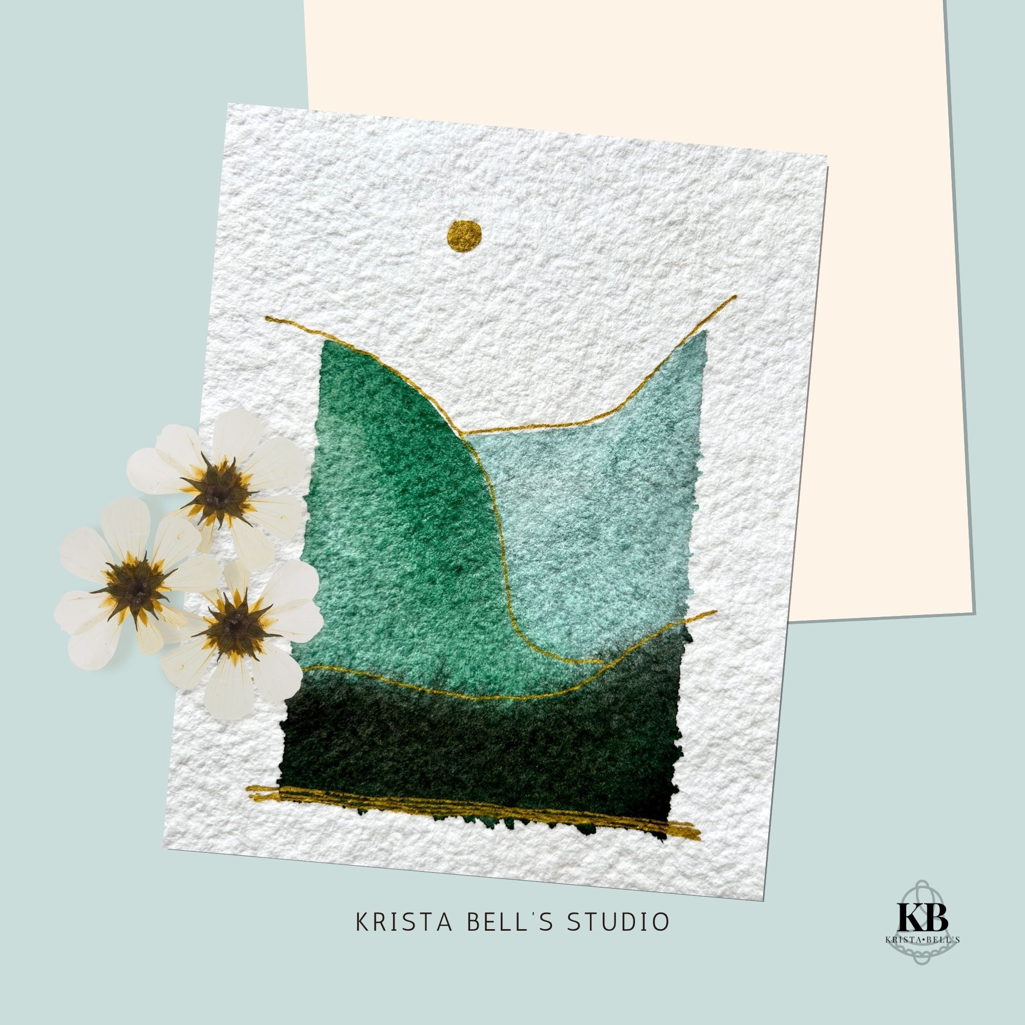 Artistic depiction of a simple modern watercolor landscape with gold accents on textured paper.