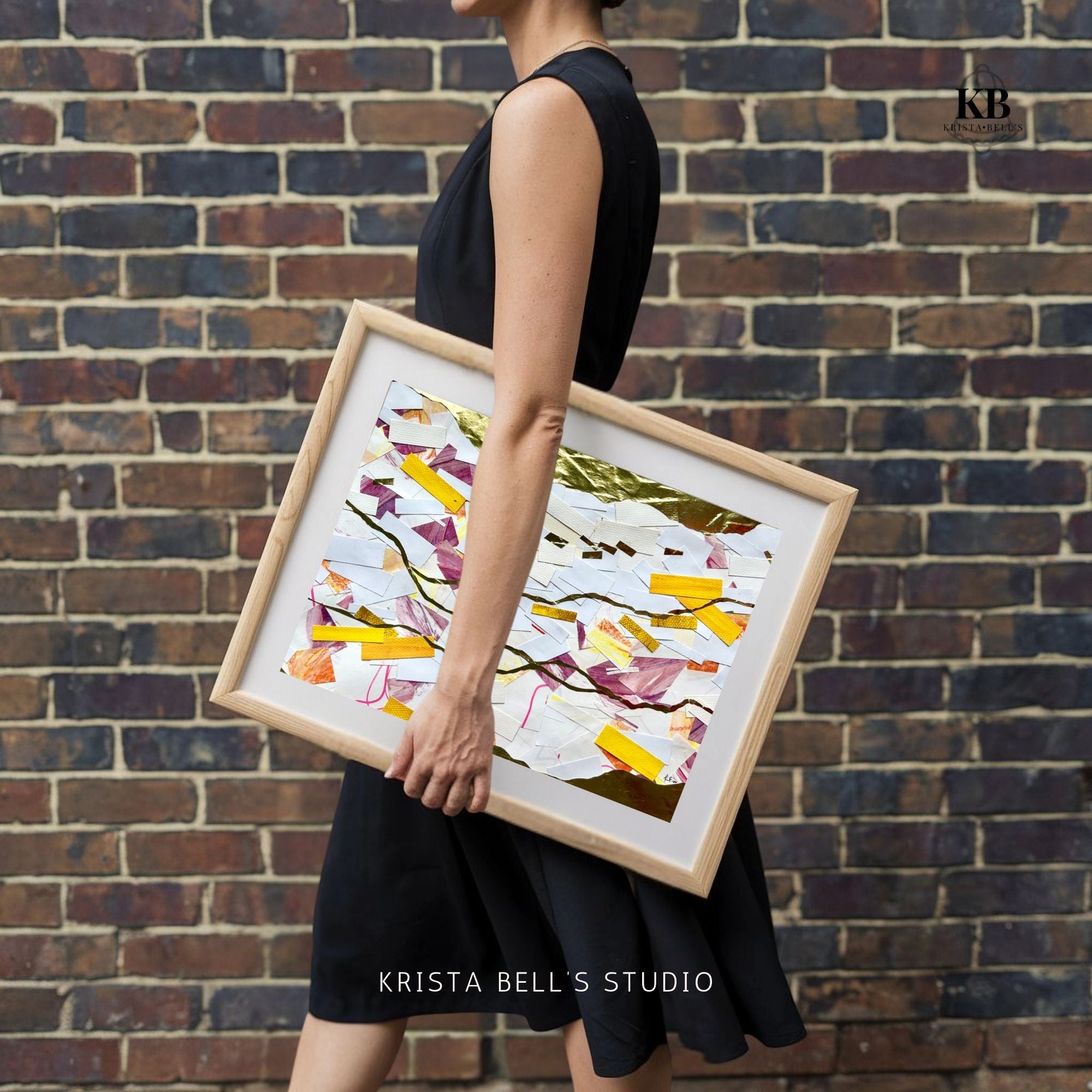 Person holding a framed abstract art piece against a brick wall, with 'Krista Bell's Studio' branding.  A calm abstract collage with meandering golden lines. Listen to the gentle guiding of the Lord. His calling is the gold line running through our lives.