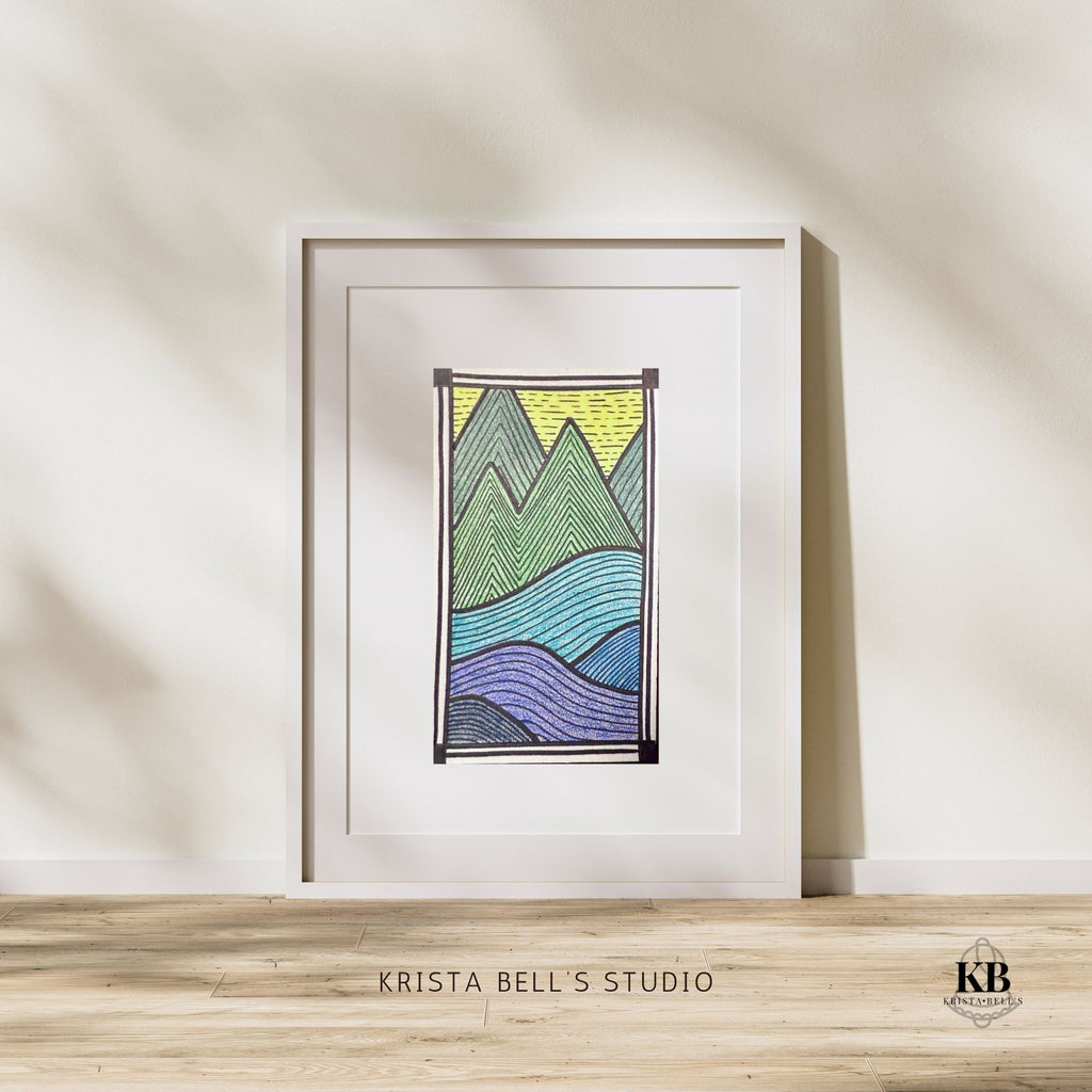 Framed abstract artwork with wavy lines on a white wall, featuring 'Krista Bell's Studio' branding.