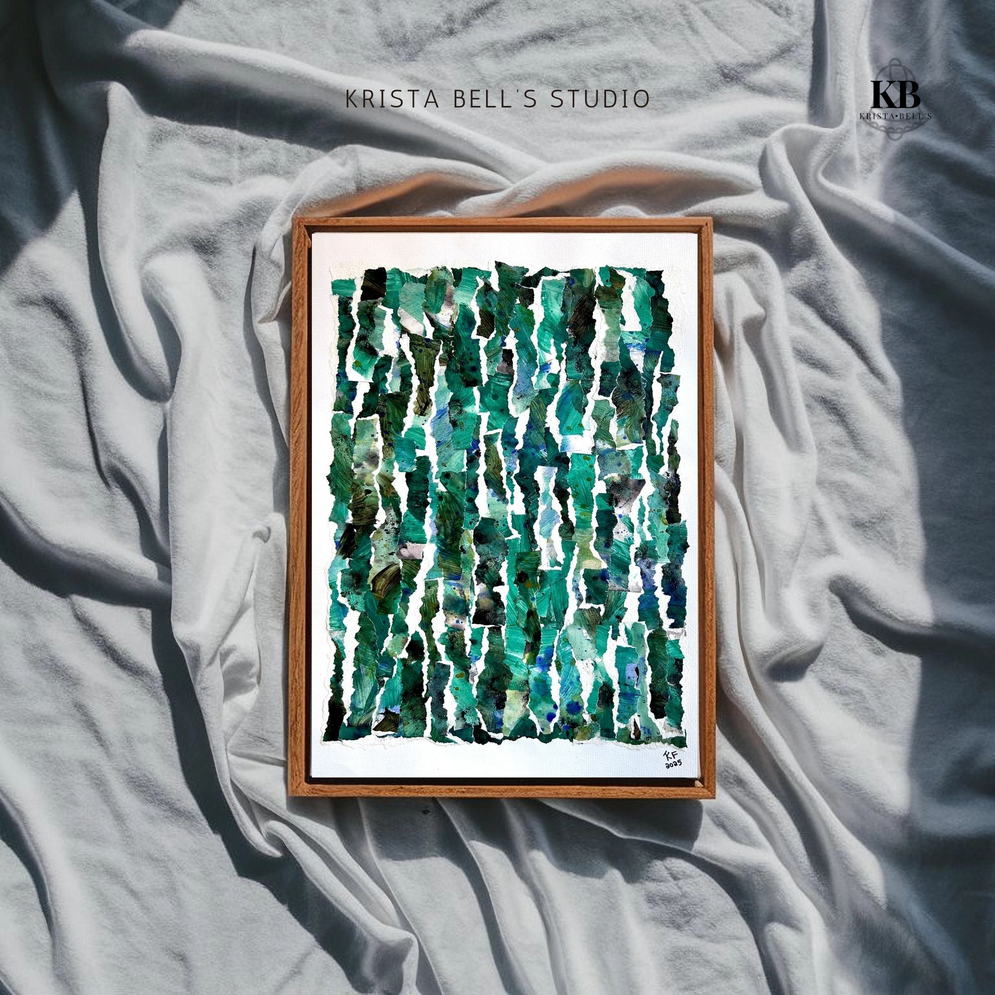 Framed abstract art piece with green patterns on a textured gray surface, featuring 'Krista Bell's Studio' branding.