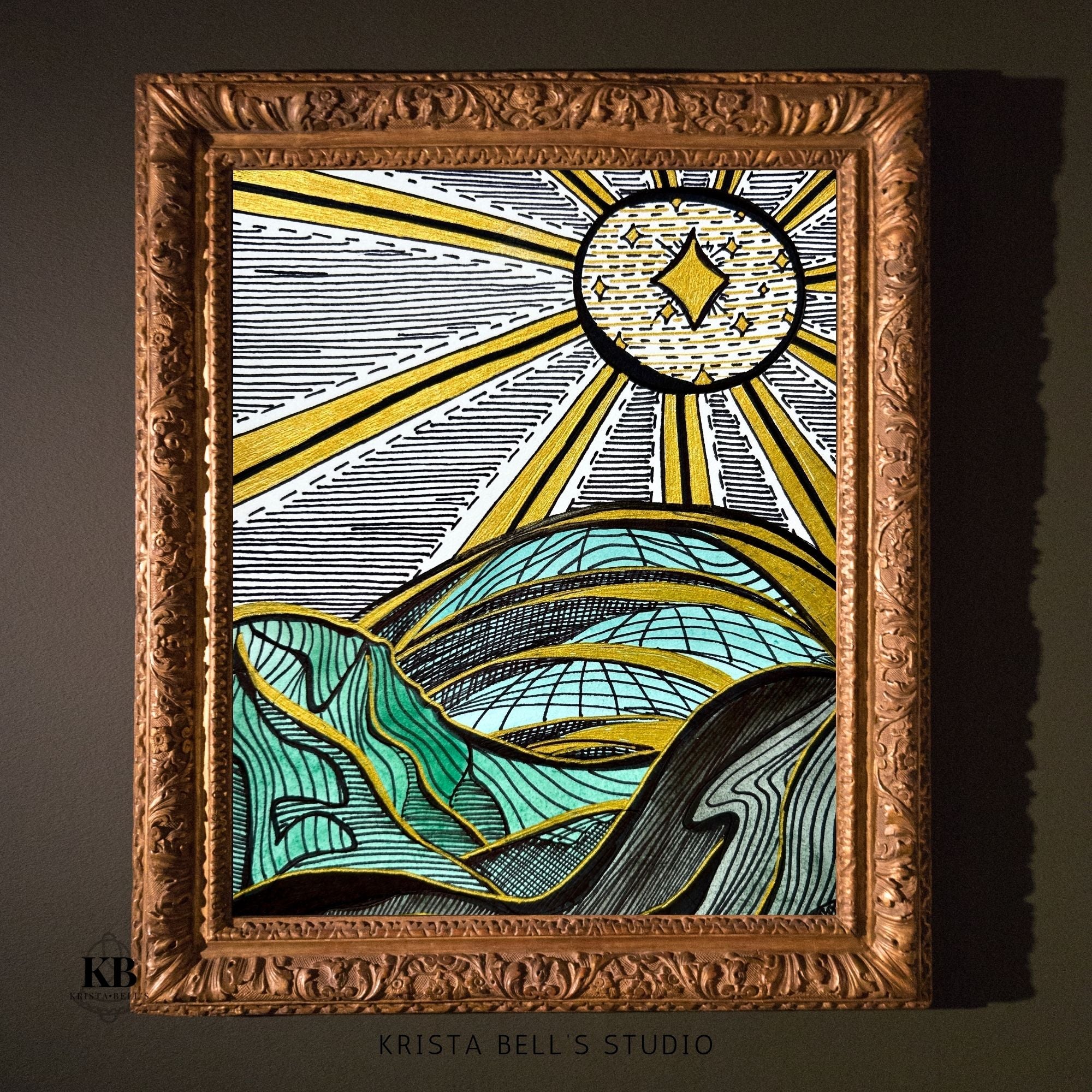 Decorative framed artwork with a stylized sun and hills design, featuring the artist's name 'Krista Bell's Studio'.
