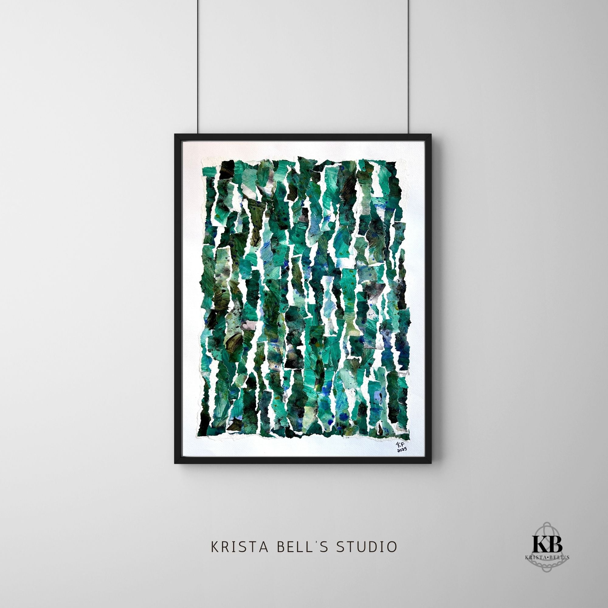 Framed abstract art print with green and blue patterns on a gray wall, featuring 'Krista Bell's Studio' branding.