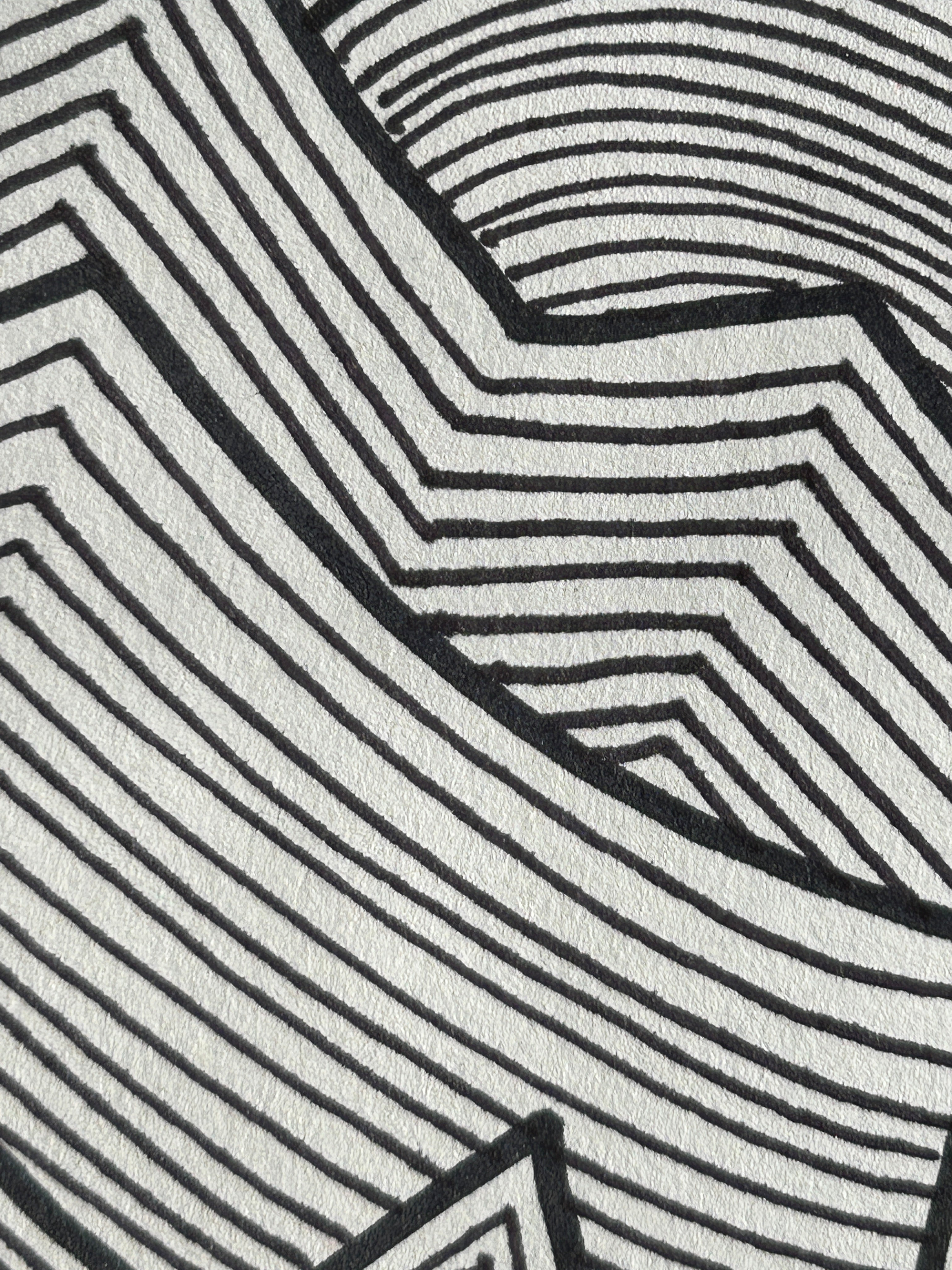 Close-up of a black and white geometric pattern artwork.