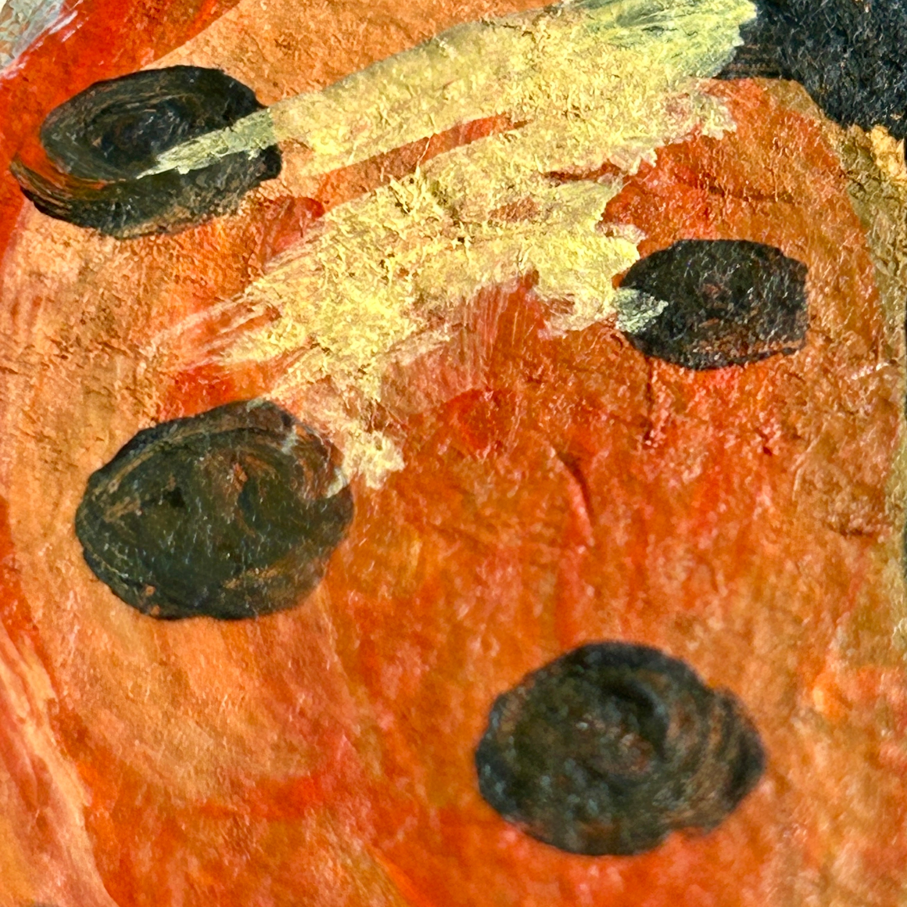 Close up of the ladybug painting that looks like abstracted orange, black, and yellow colors.