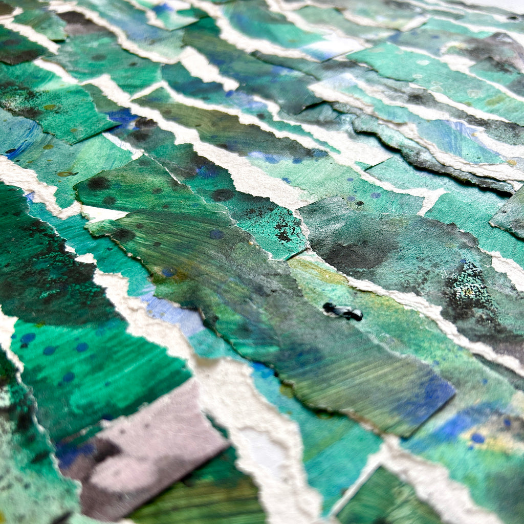Close-up of a textured surface with green and blue patterns