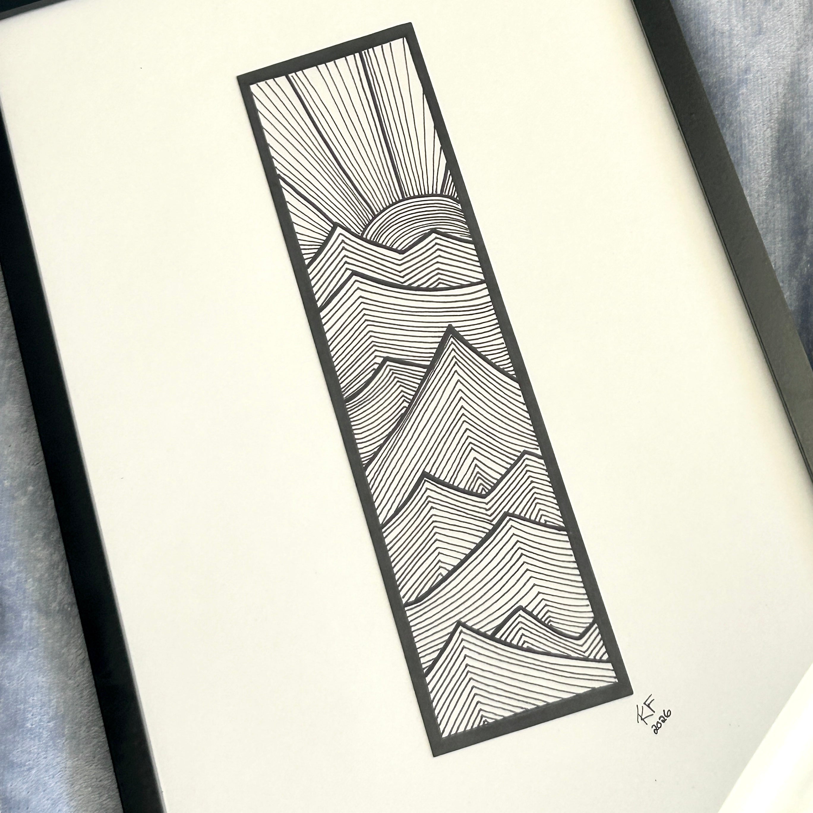 Video panning across the framed black and white line landscape.