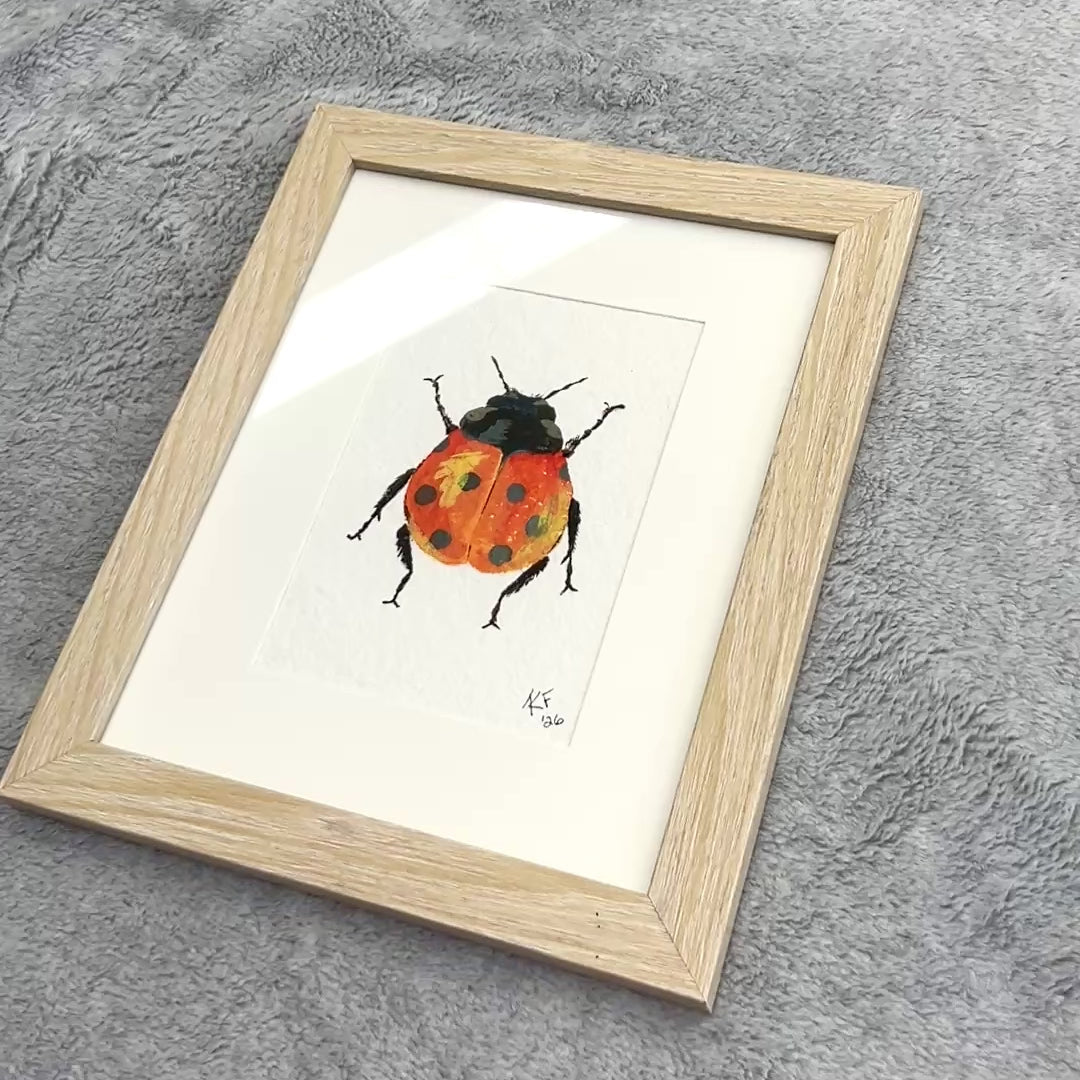 short video showing the framed artwork from different angles.