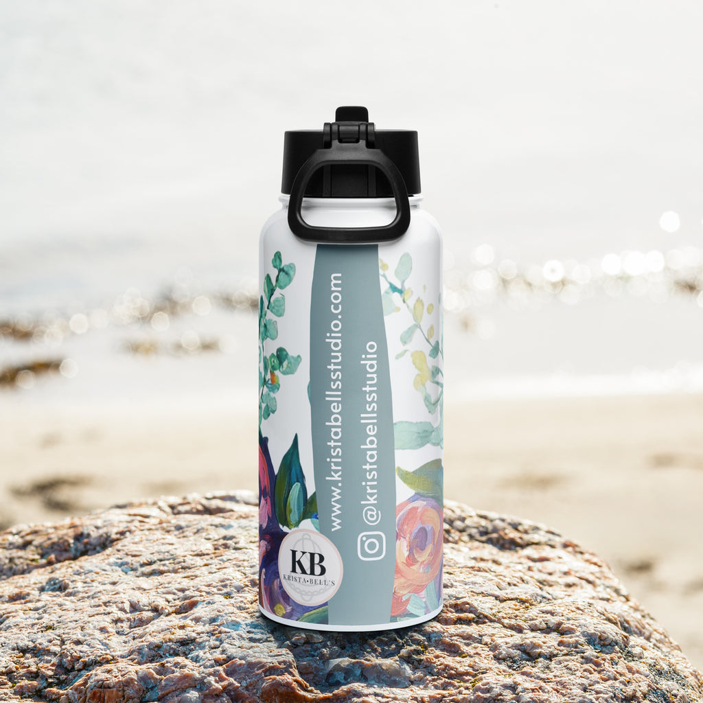 Product mockup of a 32oz stainless steel water bottle, with painted flowers on it.