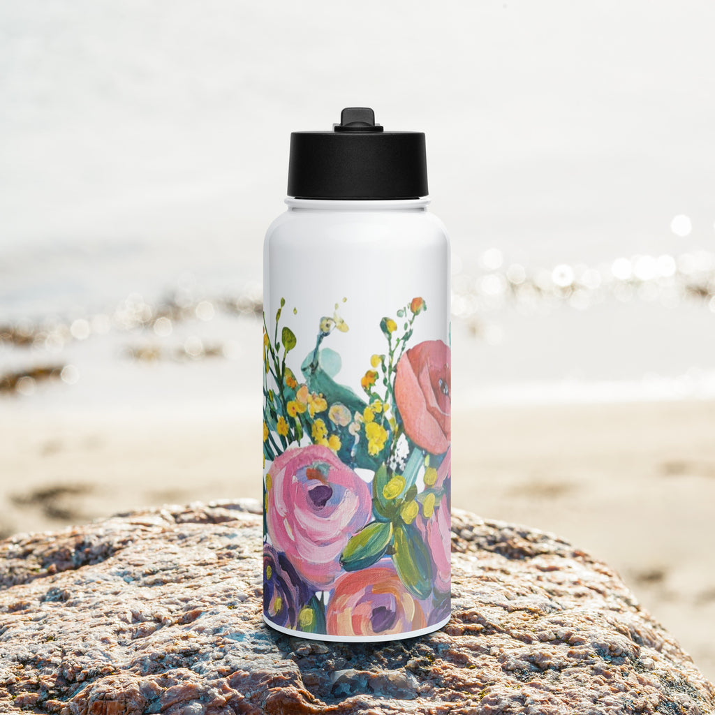 Product mockup of a 32oz stainless steel water bottle, with painted flowers on it.